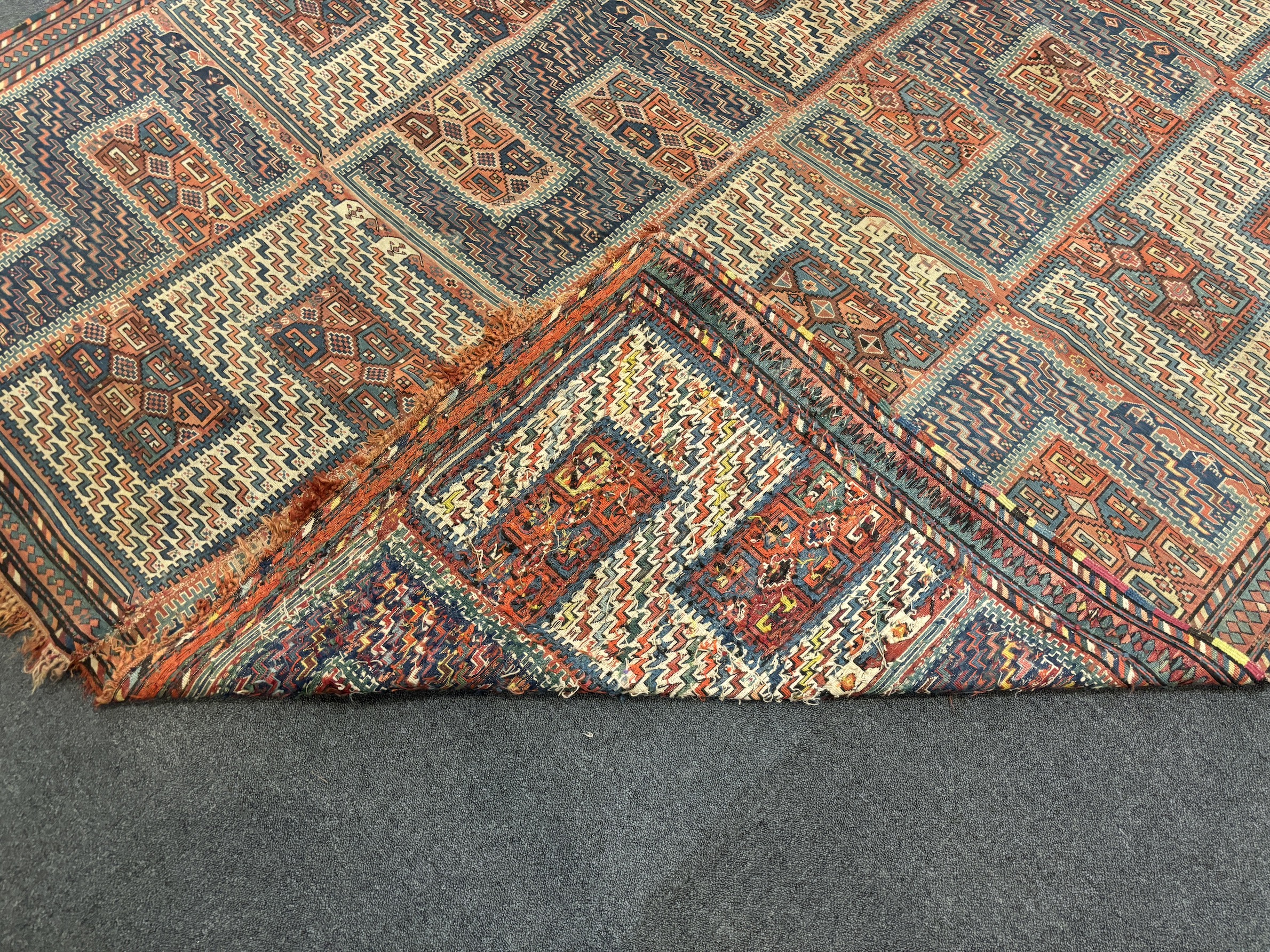 An antique Caucasian geometric rug, 255 x 210cm